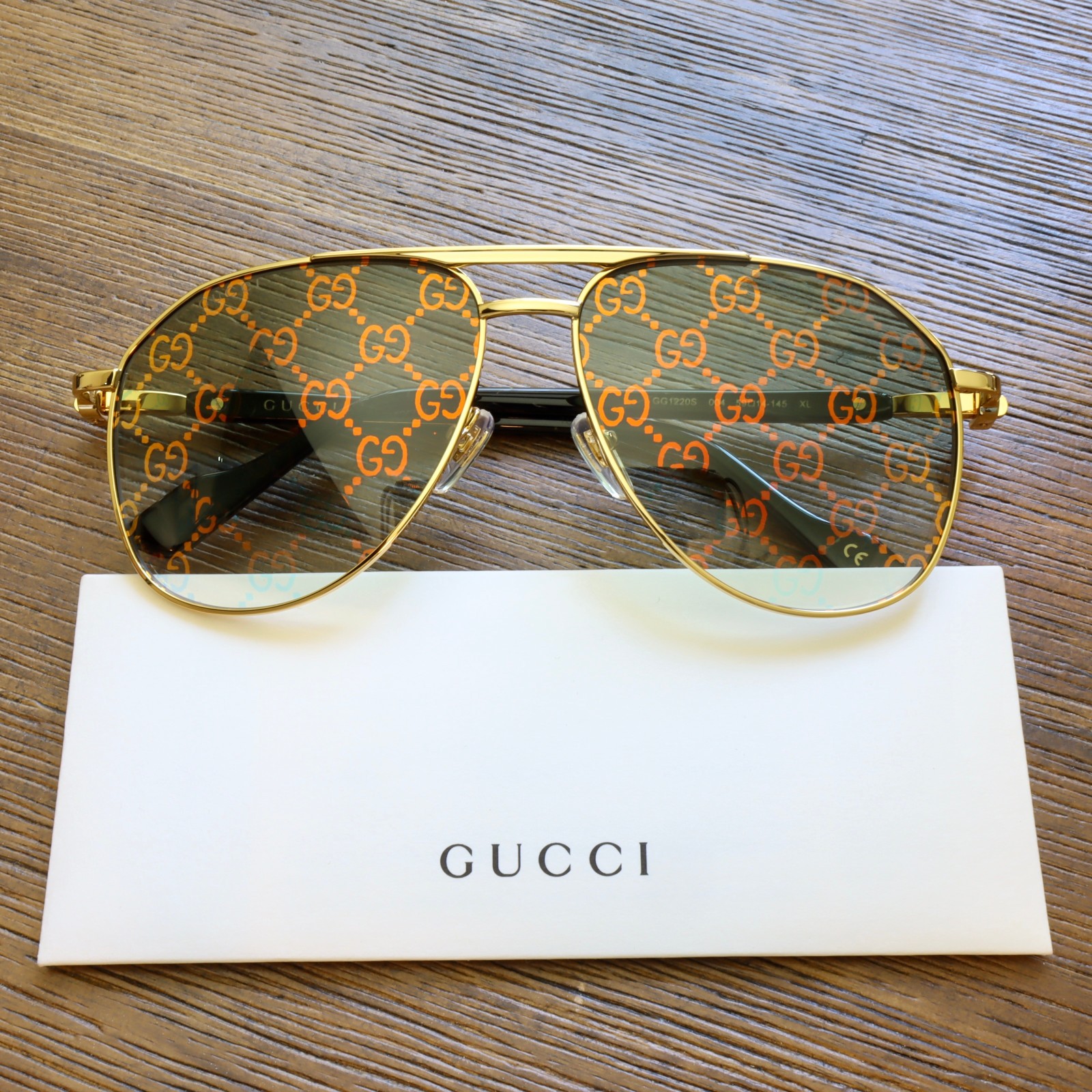 Gucci GG1220S 59mm Aviator Sunglasses in Gold with Green GG Pattern Lens