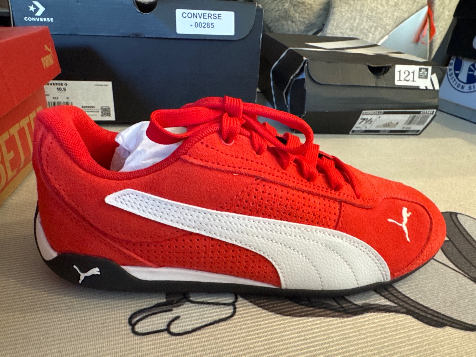 red and white Puma Replicatch SD sneakers feature a perforated suede upper with 