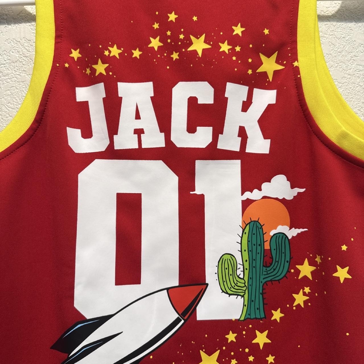 Red and yellow personalized basketball jersey with cactus, rocket, and stars