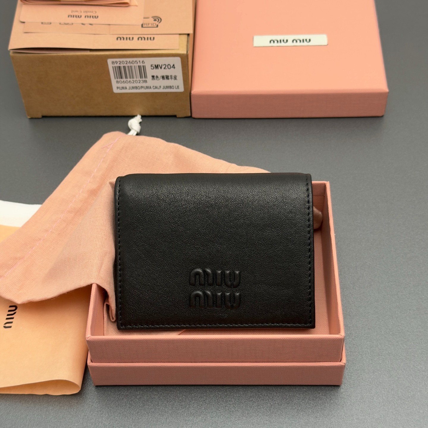 Miu Miu 5MV204 Black Leather Small Wallet Embossed Logo Snap Closure Women