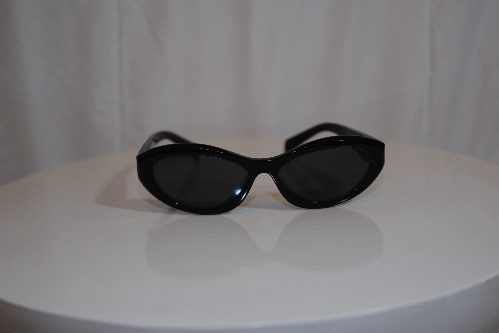 Prada Symbole Women’s Oval Sunglasses Black