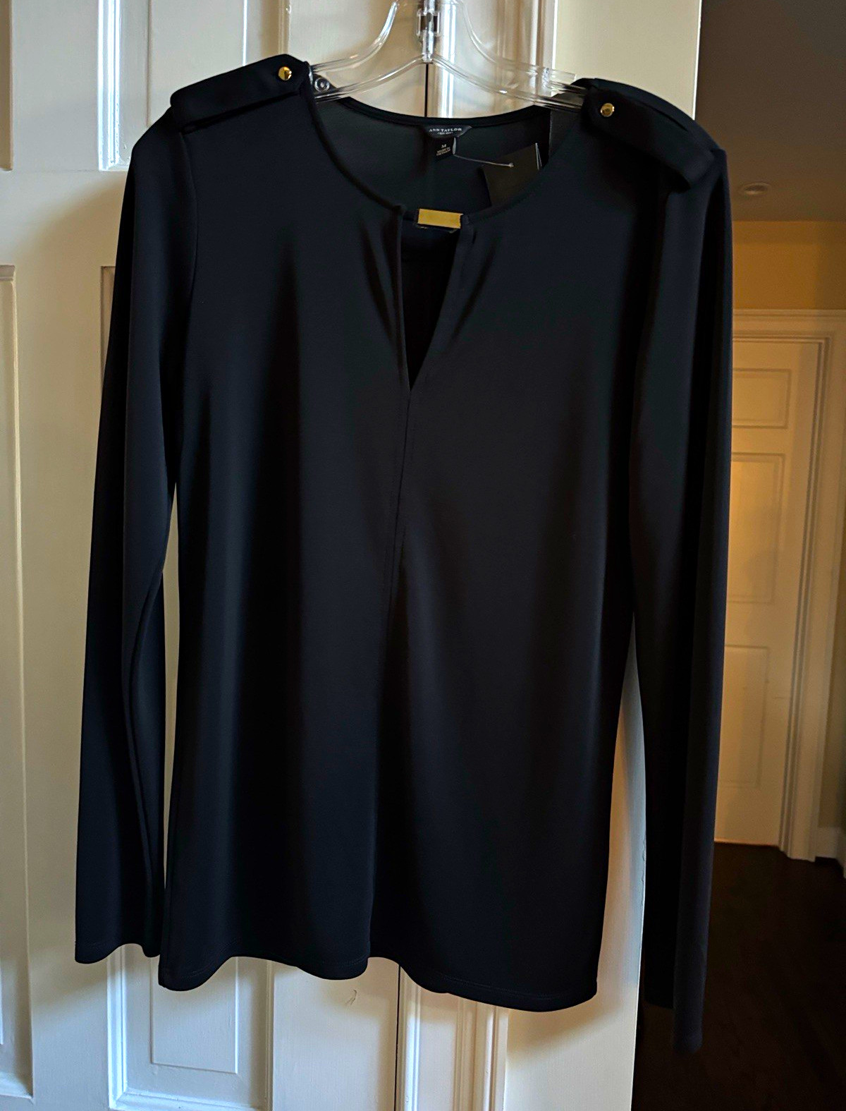 NWT Ann Taylor EST 1954 sleek black polyester top. Gold button shoulder decor. M