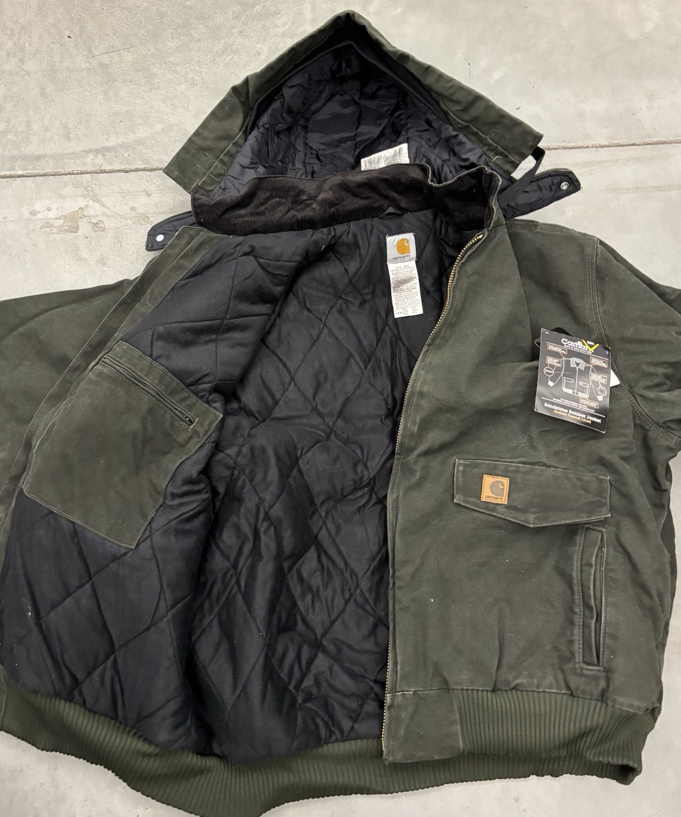 This is a Carhartt jacket  J165 MOS in a 3XL Tall size, colored in Moss Green