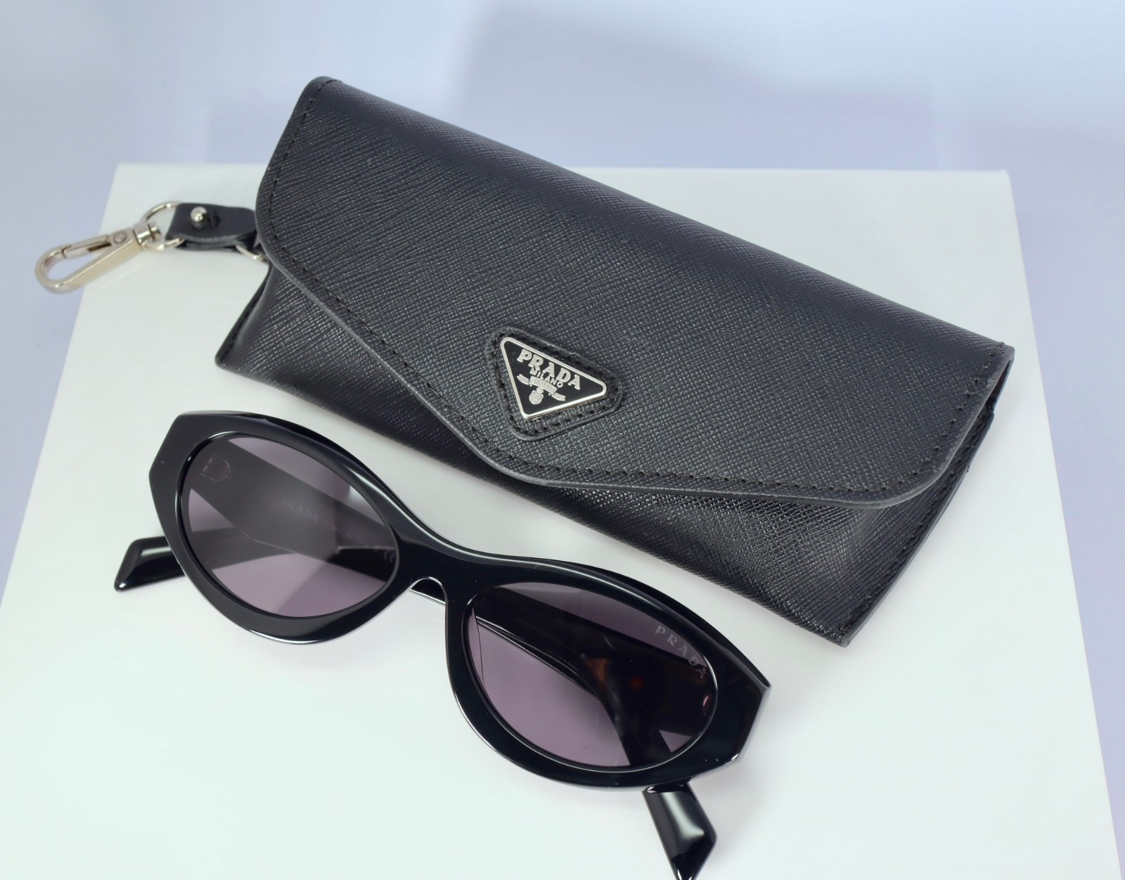 Prada PR 26ZS 16K08Z Women\'s Oval Sunglasses in Black with Gray Lens