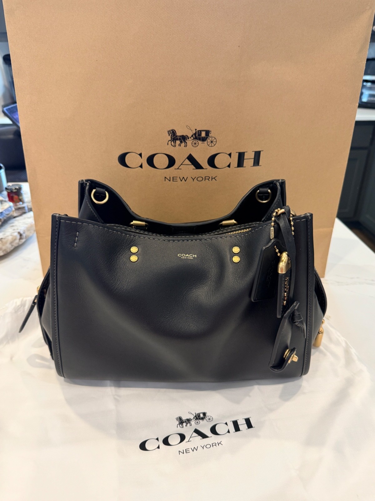 Coach Rogue 31  Black/Gold New WOT