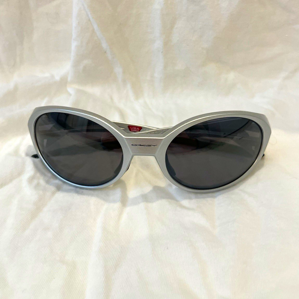 Oakley Eye Jacket Redux in a silver frame with dark lenses