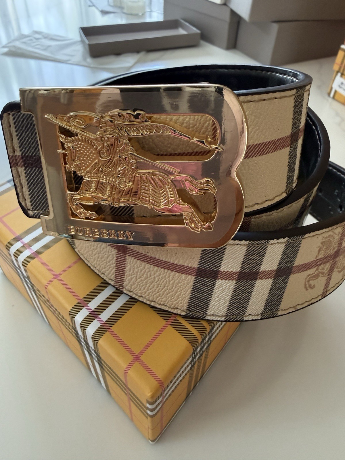 Burberry reversible belt in sand tone. polished metal buckle 