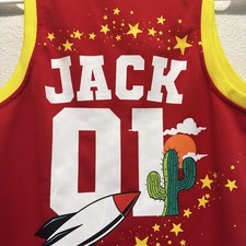 Red and yellow personalized basketball jersey with cactus, rocket, and stars picture