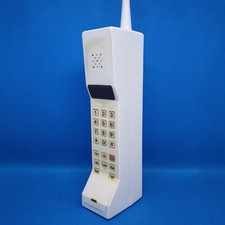 Handmade Scream Brick Phone Prop in White.  The front is a sticker/label picture