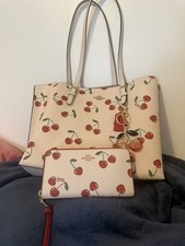 3 items ,NWOT. Authentic, Coach Mollie tote, wallet and cherry charm picture