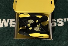 Jordan Air Jordan 4 Black/Yellow thunders Unisex Kids Athletic Lace-Up Sneaker picture